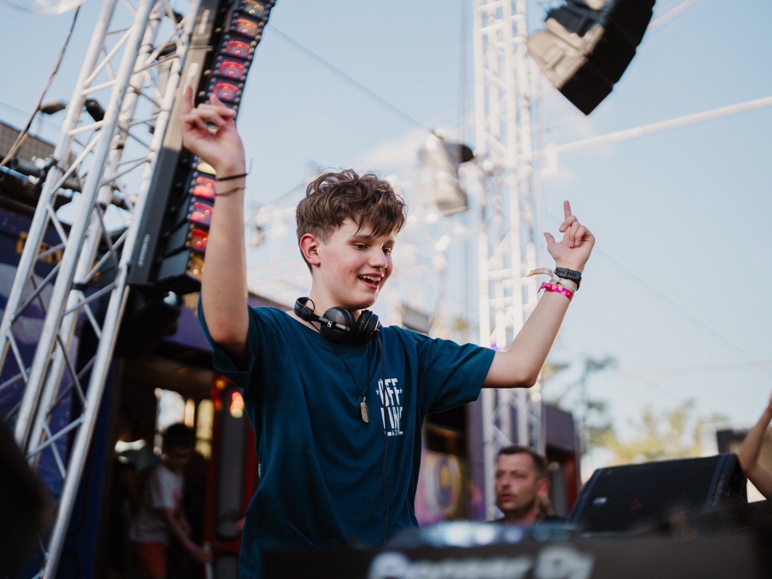 DJ Sebic smiling during a festival appearance